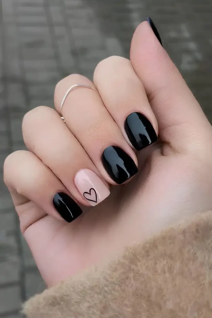 Black Nails With Heart On An Accent Nail