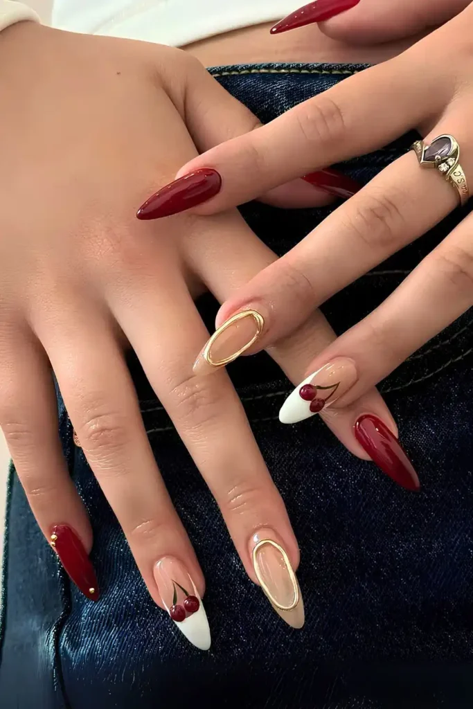 Dark Red Mani With Cherries and Gold Chrome Accents