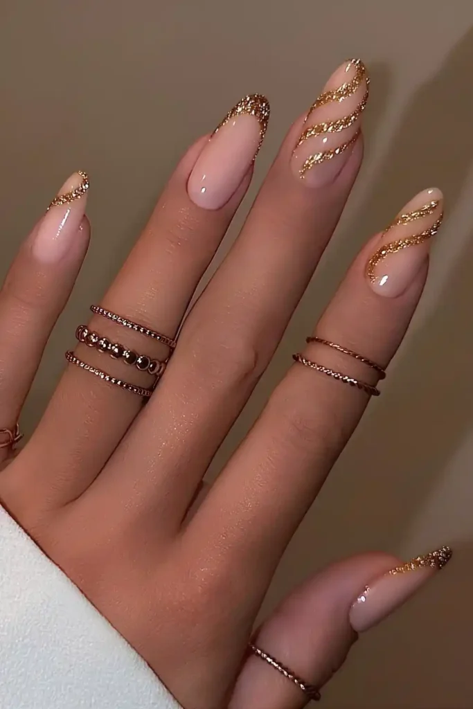 Gold Glitter French Mani With Accent Swirls for Extra Glam