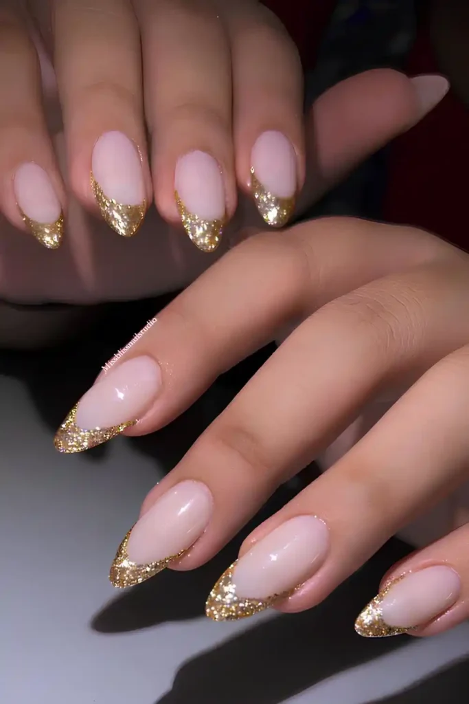 Gold Glitter French Tip Manicure With a Glamorous Shine