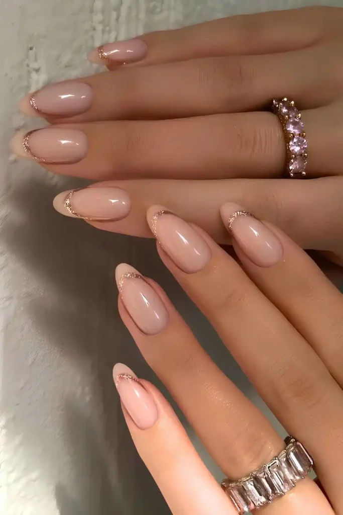 Neutral Glitter Edged French Tip Nails With a Glam Touch