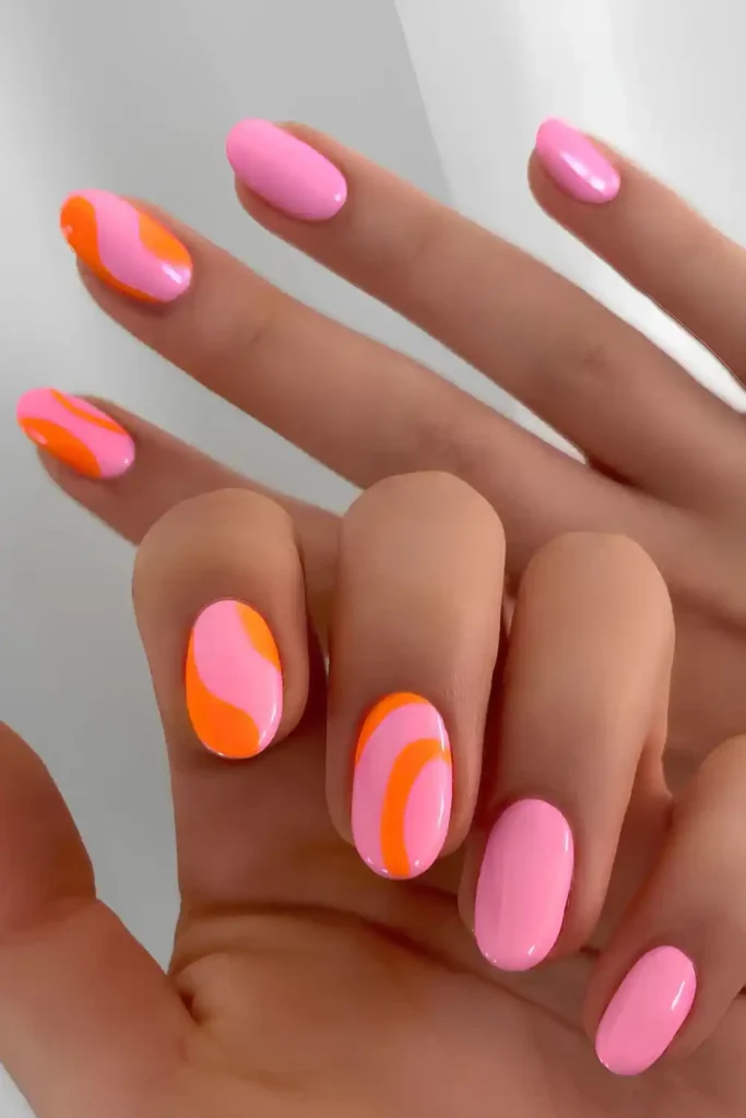 Pink Nails With Neon Orange Accents That Pop Beautifully