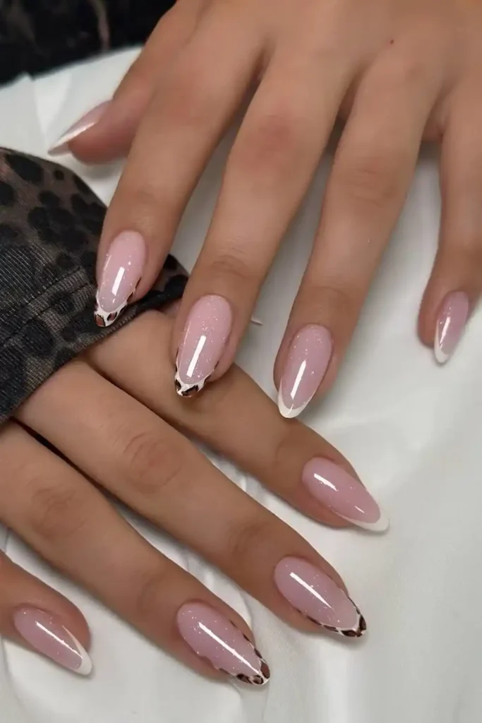 Shimmery white French mani with leopard-print-details