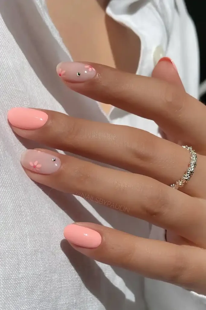 Short Pink Nails With Flowers and Gems That Sparkle