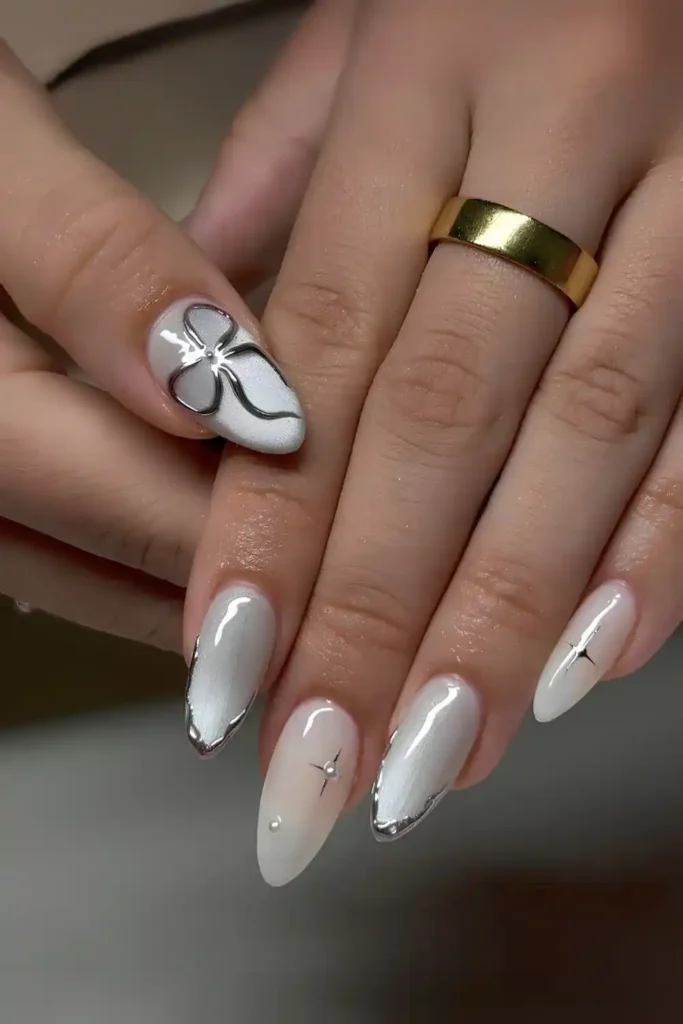White Cat Eye Nails With Chrome Bows and Stars That Sparkle
