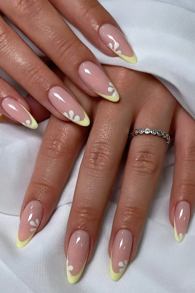 Yellow French Manicure With Daisy Art for a Fresh Spring Look