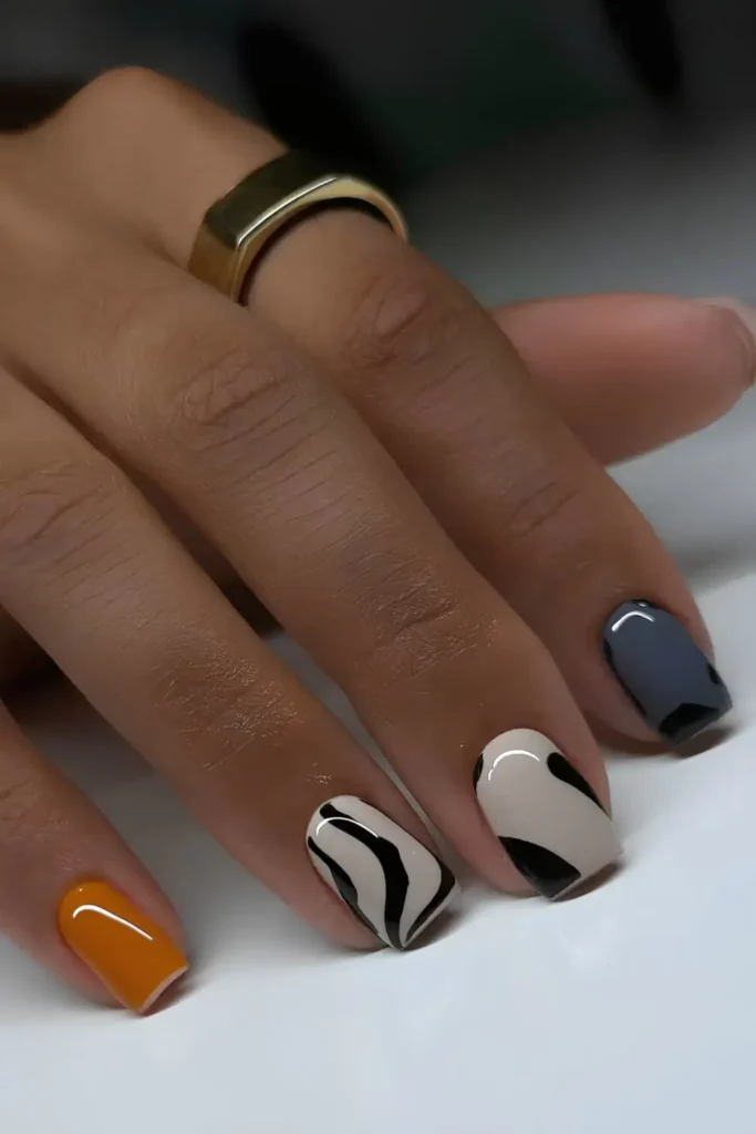 Artsy Animal Print Nails in Orange and Grey That Make a Bold Statement