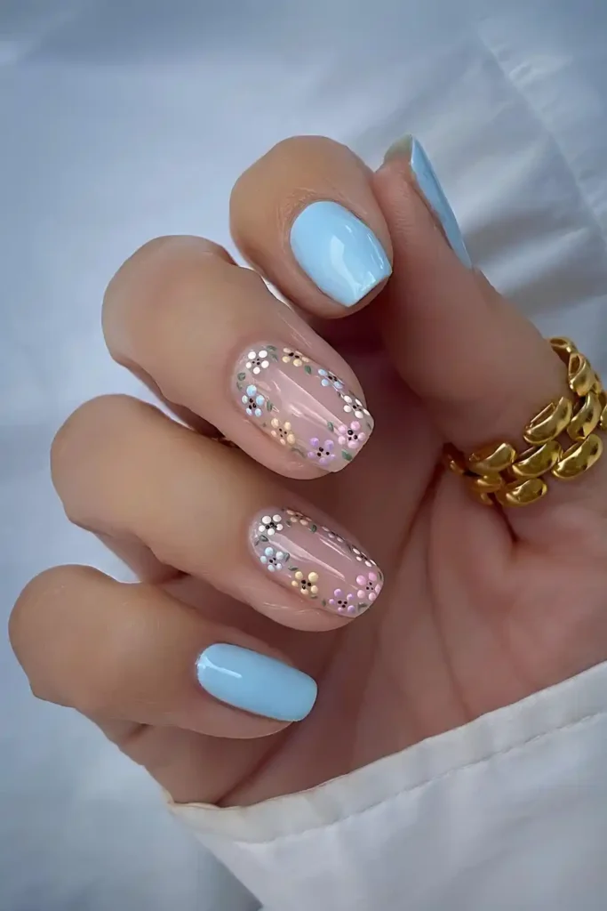Baby Blue Mani With Colorful Flowers for a Cheerful Look