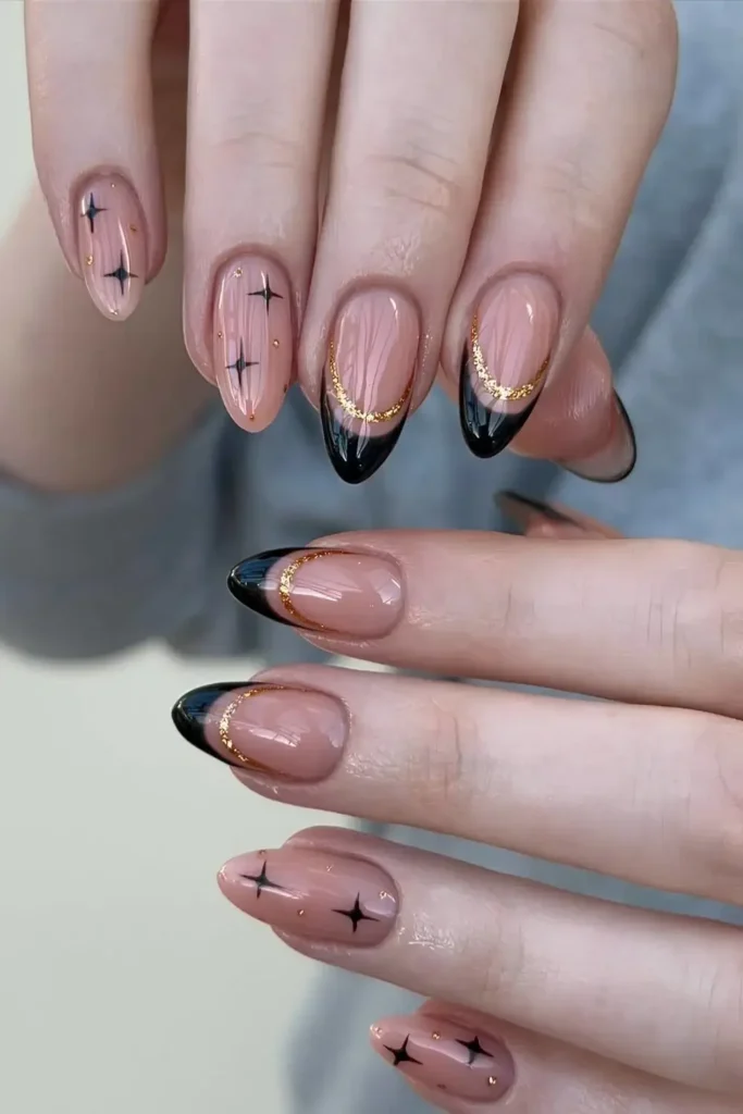 Black French Nails With Gold Glitter Lines and Stars