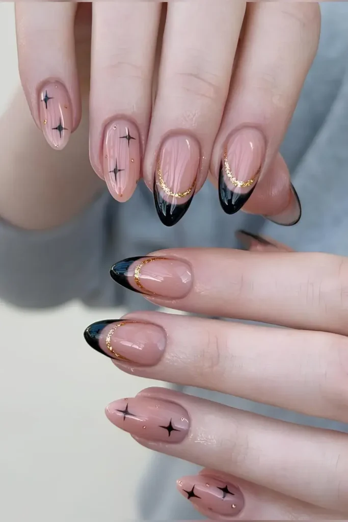 Black French Nails With Gold Lines and Stars