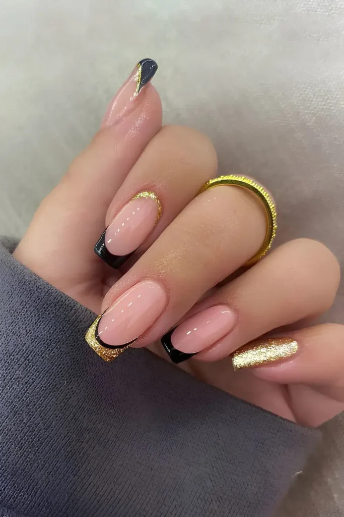 Black and Gold Glitter Manicure That Sparkles Beautifully