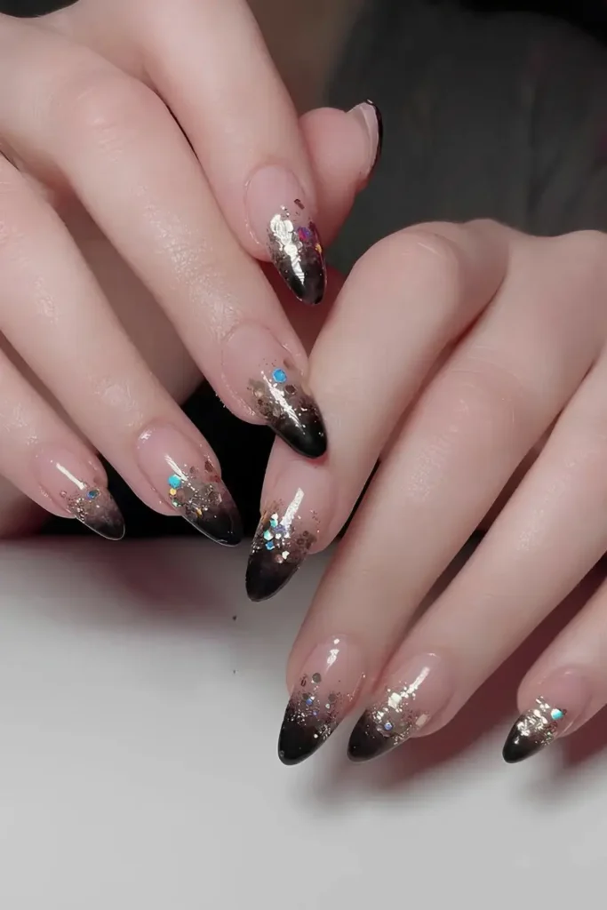 Black and Gold Glitter Ombre Nails That Shine Beautifully