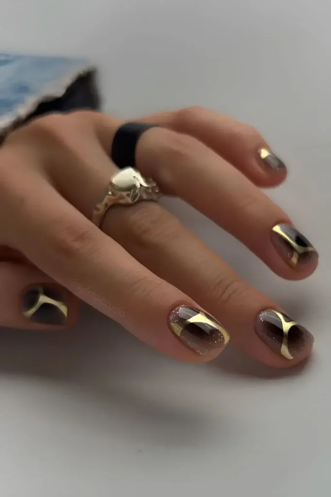 Black Mani With Abstract Gold Accent for a Modern Look