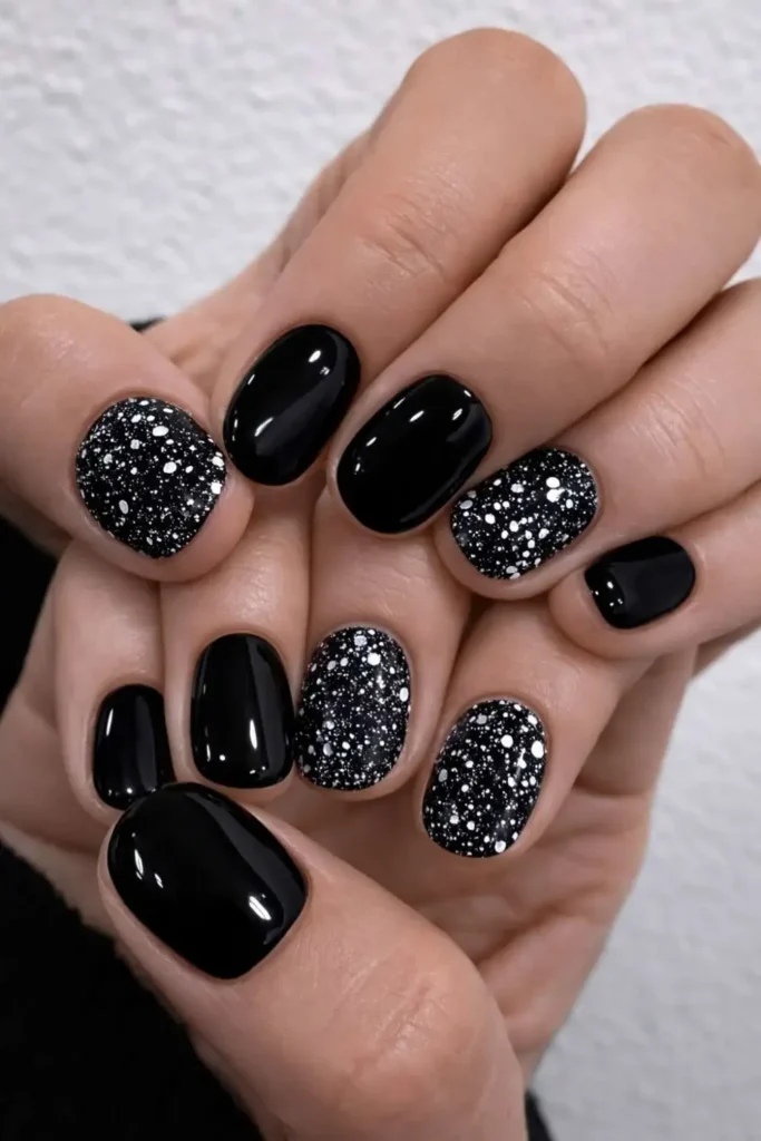 Black Nails With Chunky Silver Glitter That Stand Out