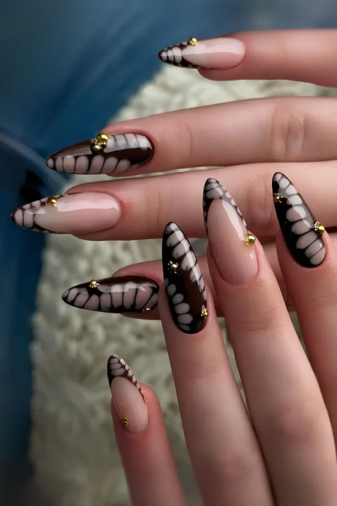 Black Nails With Snake Print Details for a Bold Look