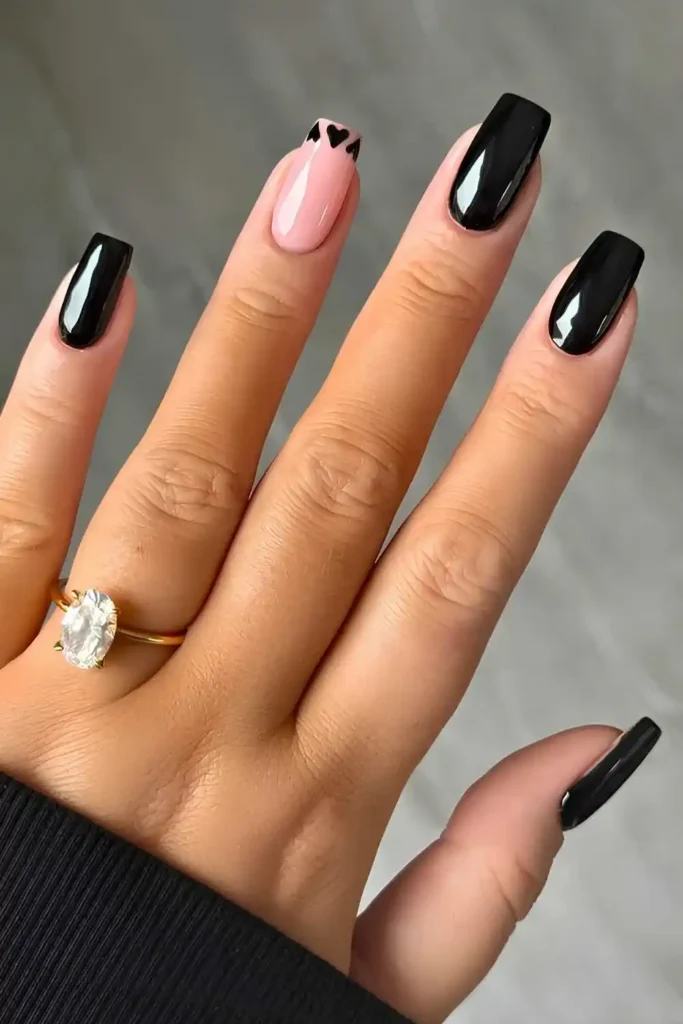 Black Nails With Tiny Heart Art for a Sweet Minimal Touch