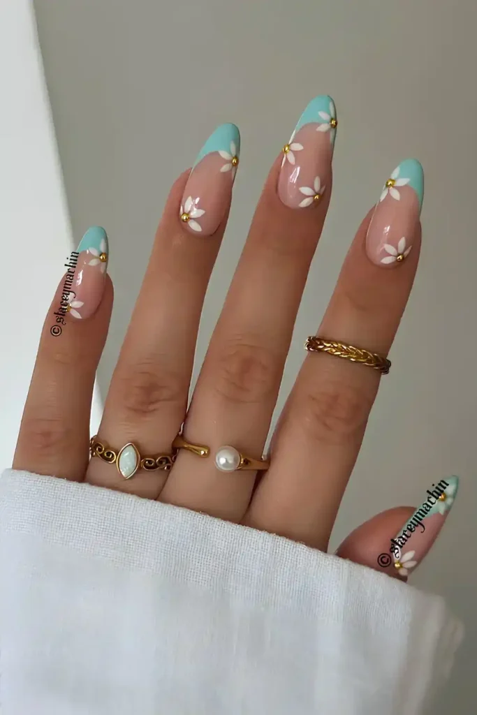 Blue French Nails With Daisy Art for a Sweet Floral Touch