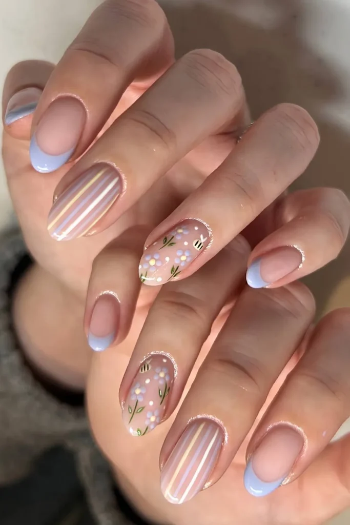 Blue French Nails With Stripes and Bees for a Fun Whimsical Style