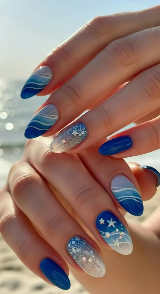 Blue Ocean Wave Nails With Glitter and Star Accents for a Magical Look