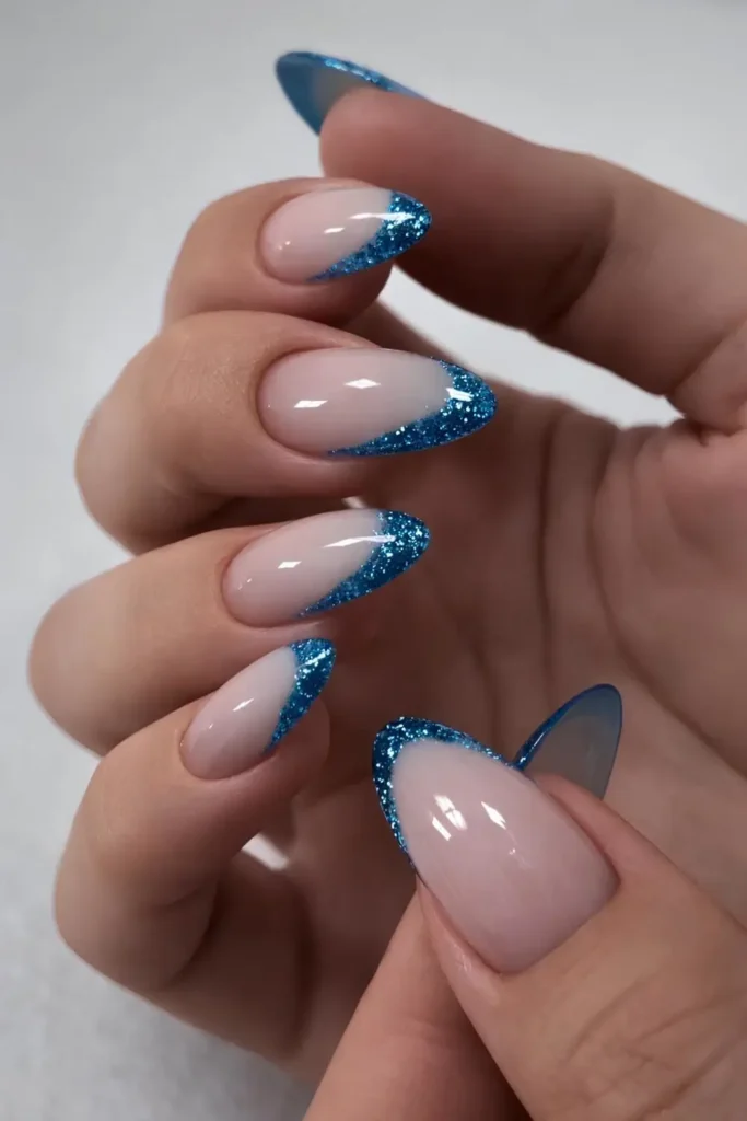 Blue Glitter French Tip Mani for a Bold Glam Look