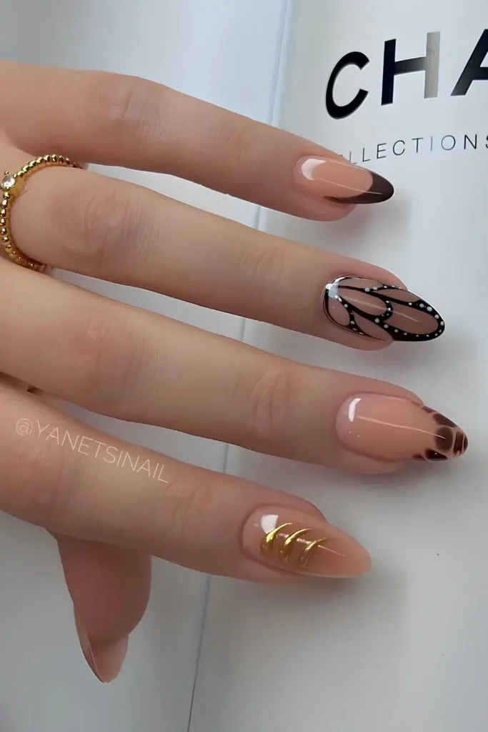 Brown and Black Nails With Gold and Butterfly Accents That Make a Statement
