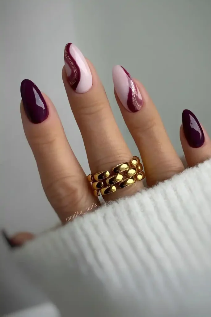 Burgundy Nails With Accent Swirls and Glitter That Shine Beautifully