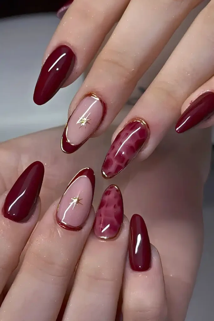 Burgundy Nails With Animal Print and Gold Accents for a Luxe Style