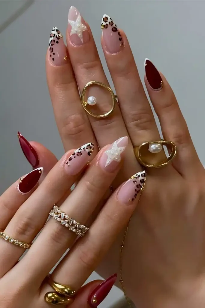 Burgundy Nails With Stars and Animal Print That Stand Out