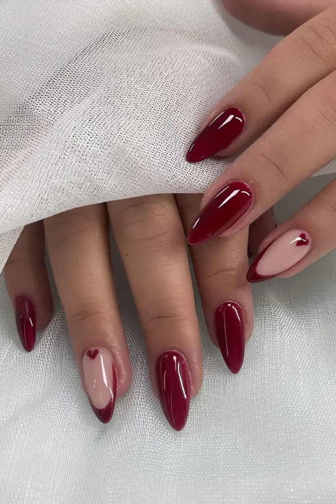 Cherry Red Nails With Heart Accent for a Sweet Romantic Look