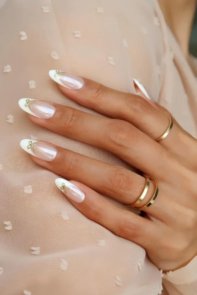 Chrome French Tips With Gold Bows That Sparkle Beautifully