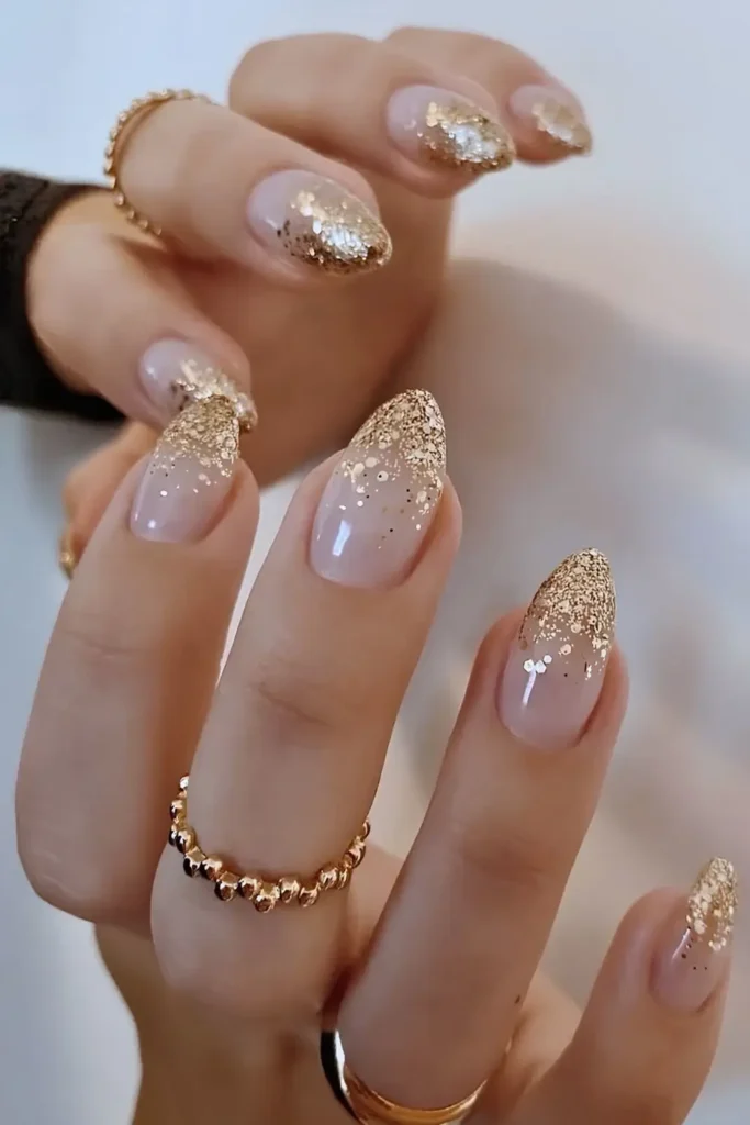 Chunky Gold Glitter Ombre Nails for a Bold Look