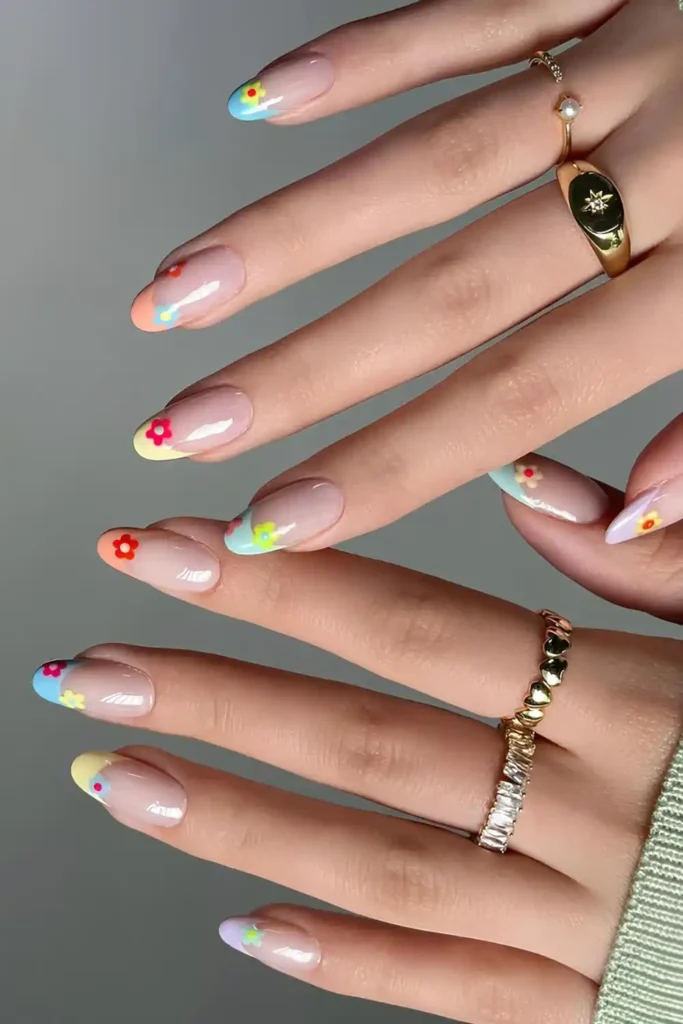 Colorful French Nails With Flower Accents That Stand Out Beautifully