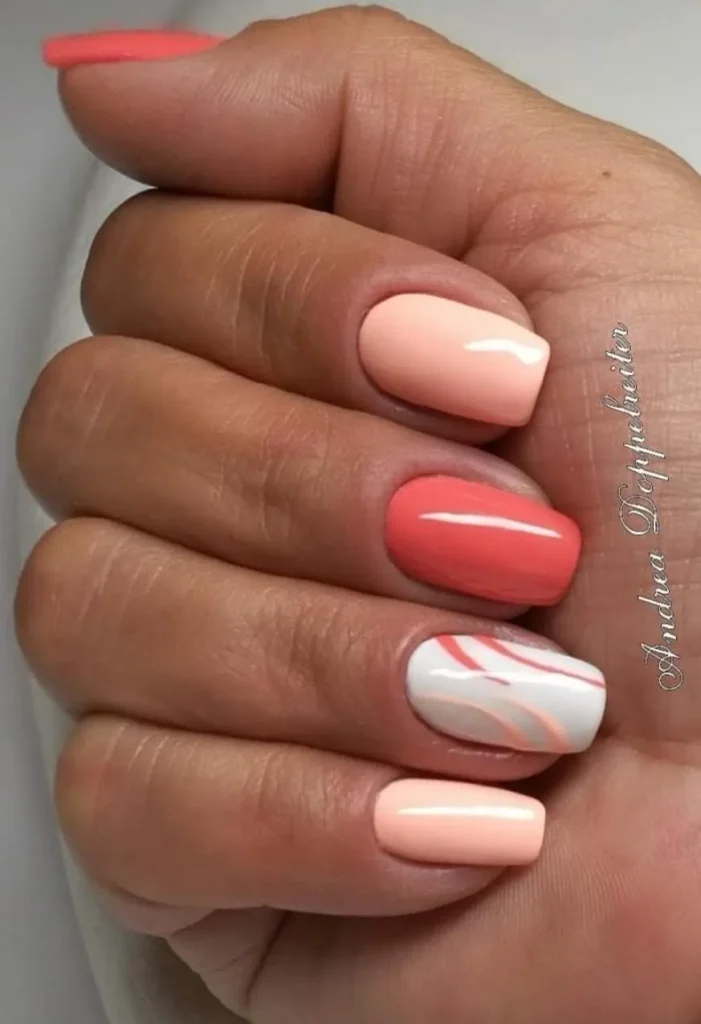 Coral and White Swirl Nails With Soft Abstract Waves