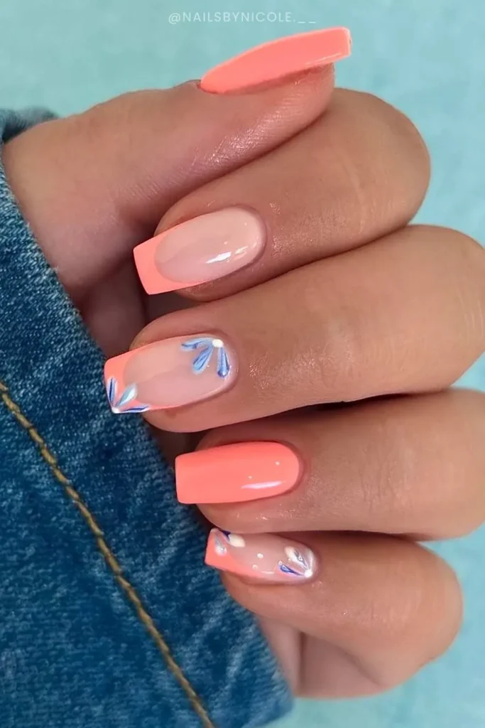 Coral Nails With Blue Floral Art for a Vibrant Look