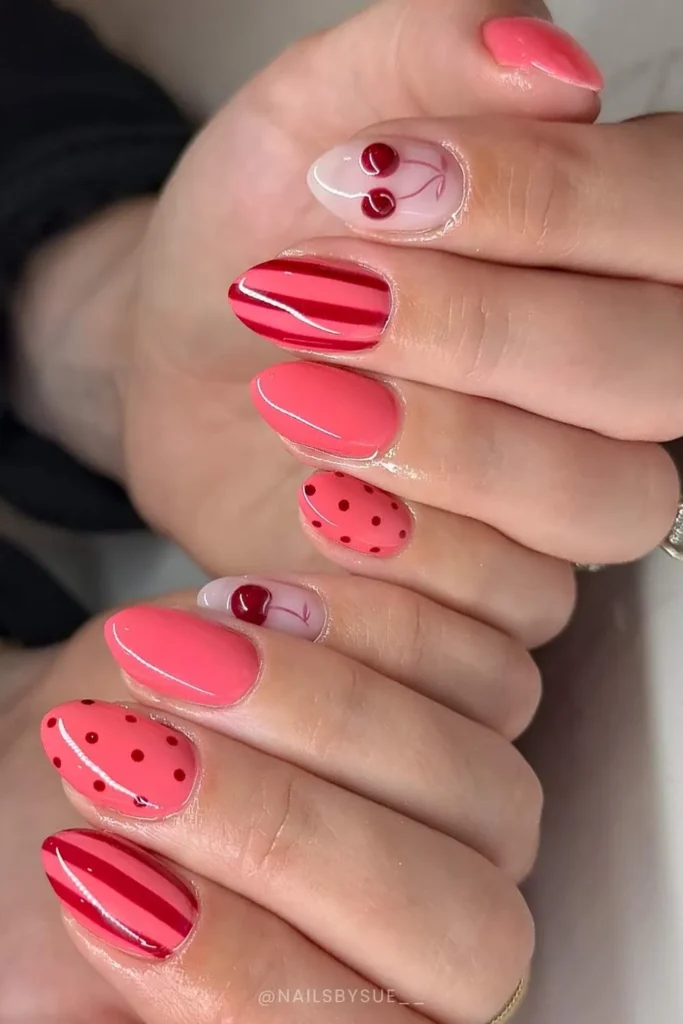 Coral Nails With Cherry and Stripe Art That Stand Out