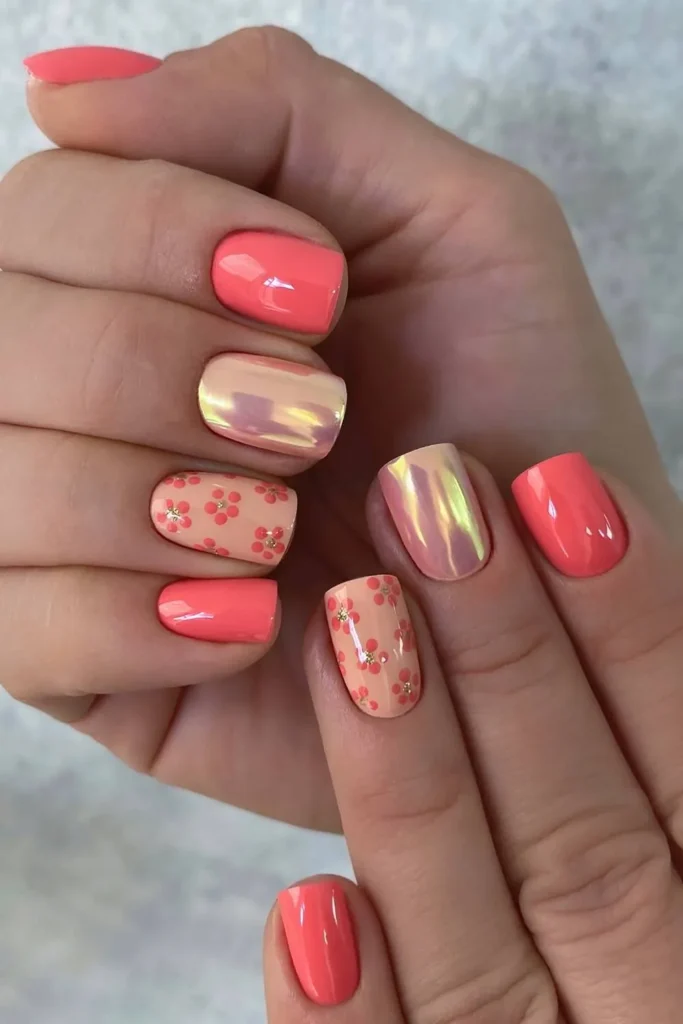 Coral Nails With Gold and Floral Accents That Shine Beautifully