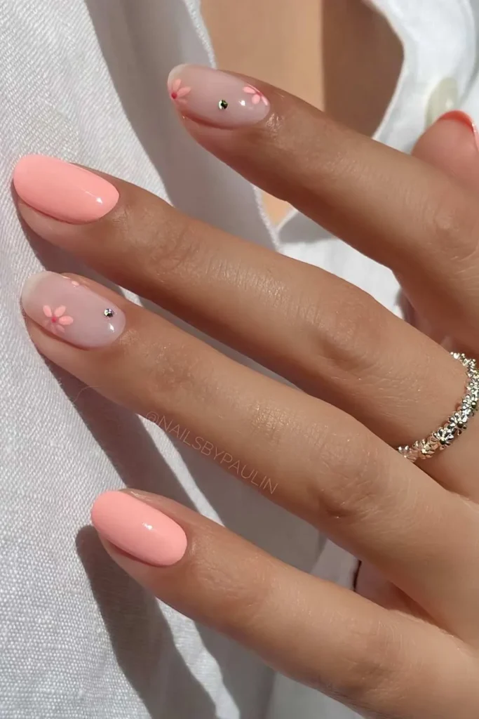 Coral Pink Nails With Flowers and Gems That Sparkle Beautifully