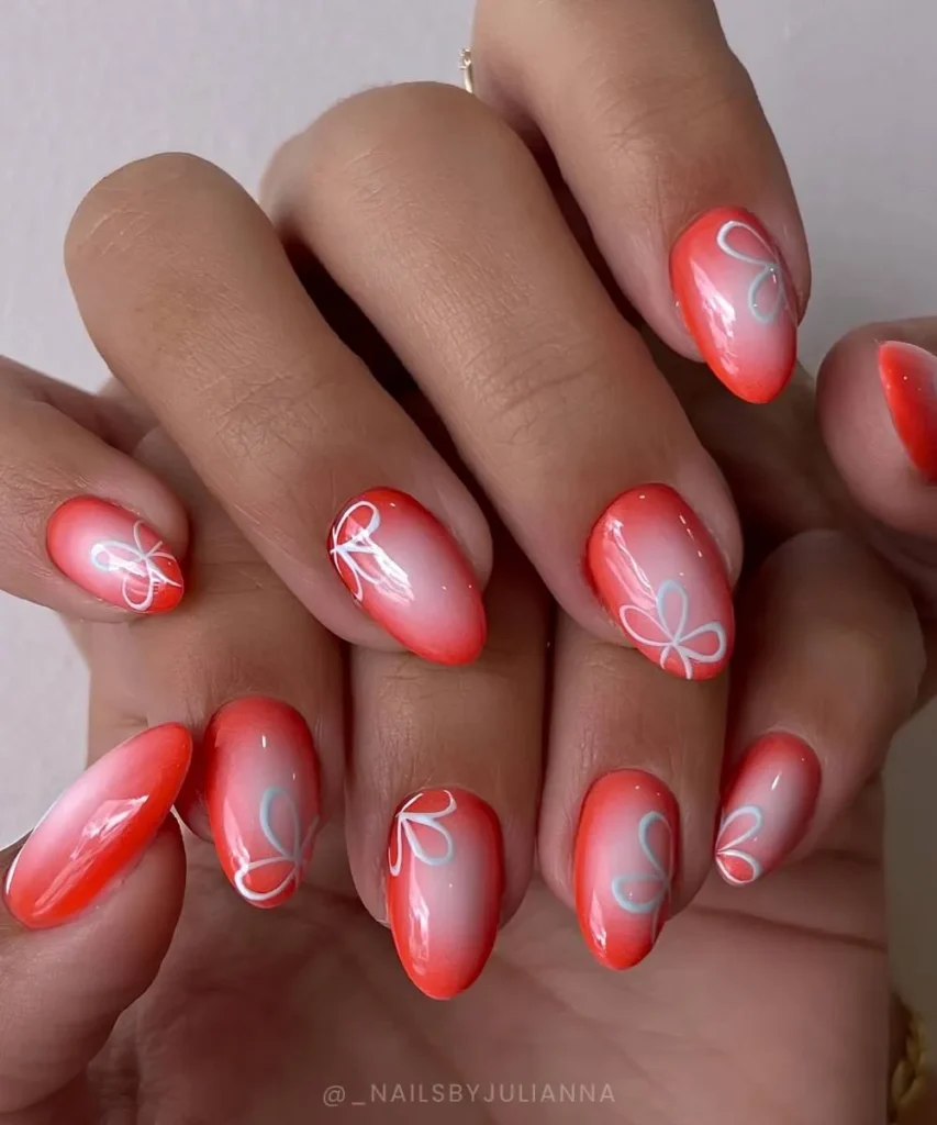 Coral Red Nails With Floral Art for an Elegant Look