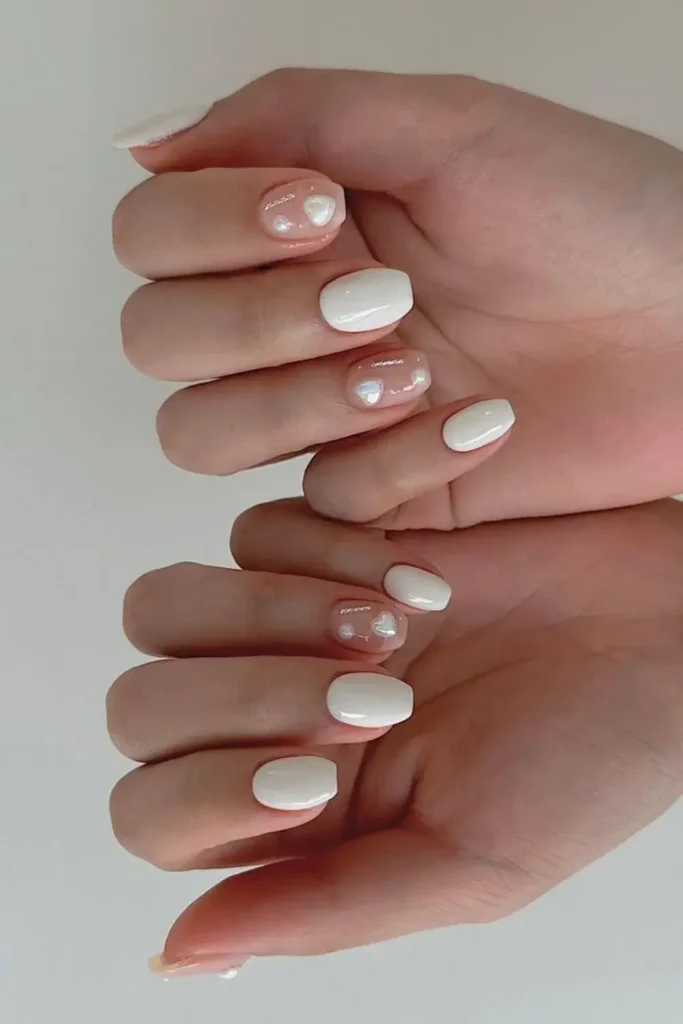 Creamy White Nails With 3D Heart Shaped Pearls for a Romantic Look