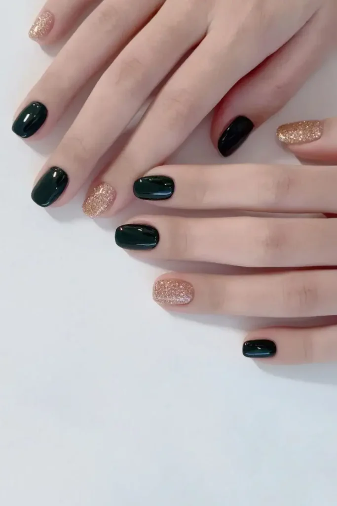 Dark Green Mani With Gold Glitter for a Glamorous Finish