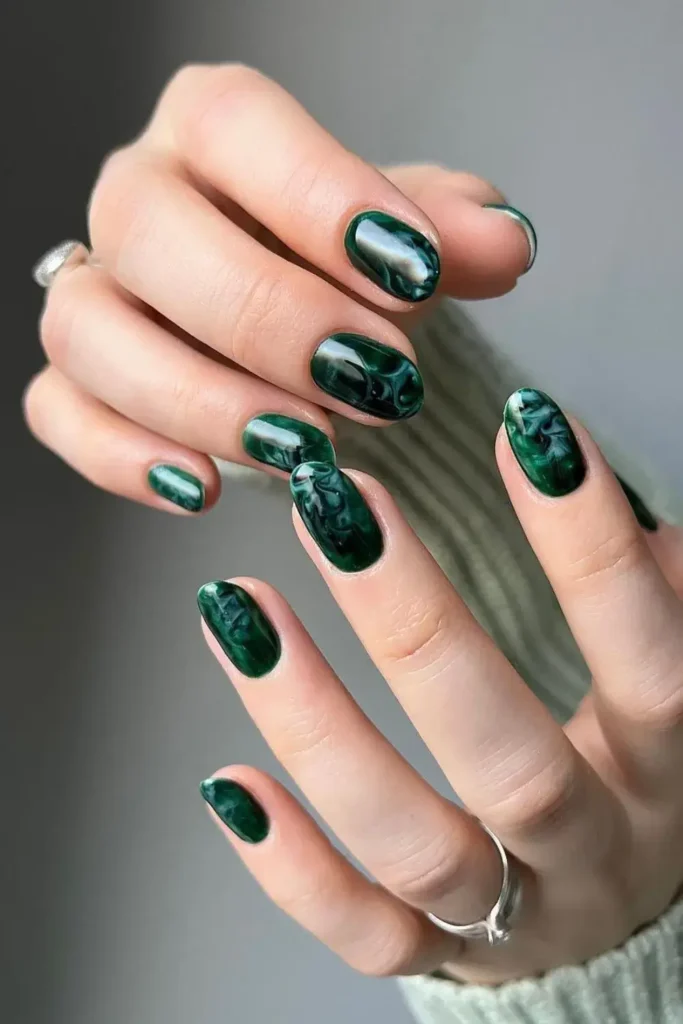 Dark Green Marble Mani With a Luxurious Stone Inspired Finish