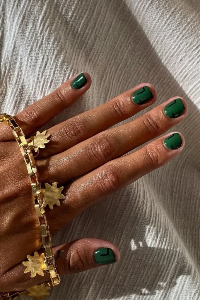 Dark Green Nails With Abstract Accents for a Bold Modern Look