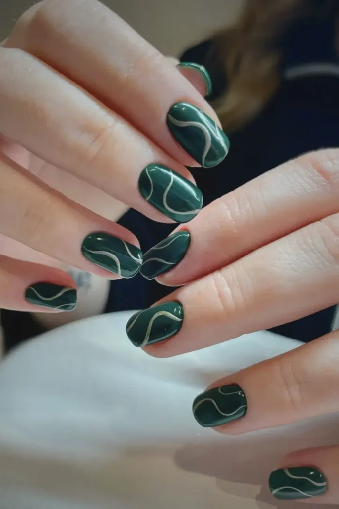 Dark Green Nails With Abstract Swirls for a Creative Modern Style