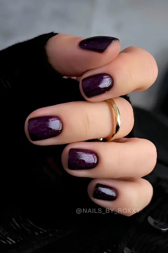 Dark Purple Nails With Shimmer for a Glamorous Look