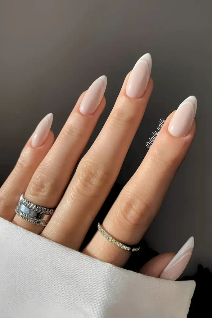Double White French Tips on a Milky Base for a Chic Modern Style