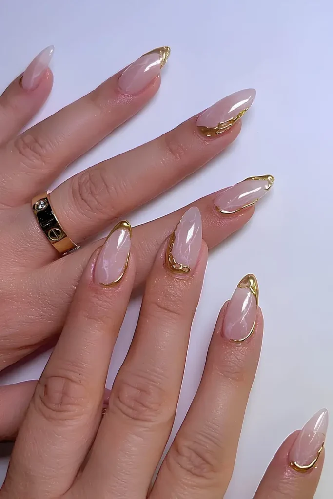 Elegant White Marble Nails With Gold Accents That Look Luxurious