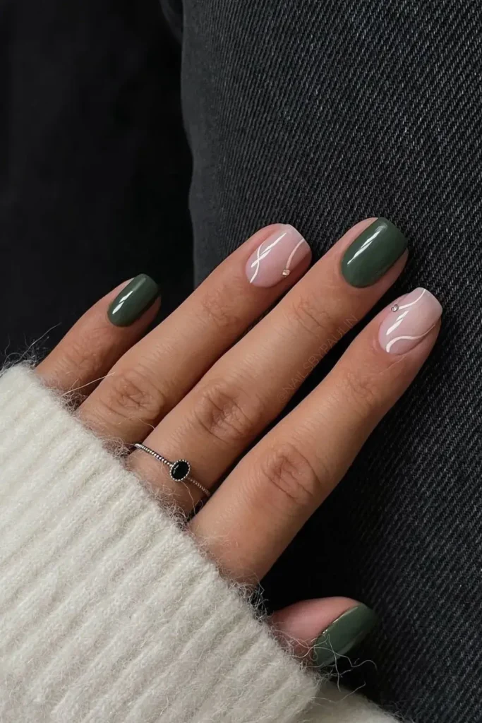 Forest Green Nails With White Swirls and Studs That Stand Out Beautifully