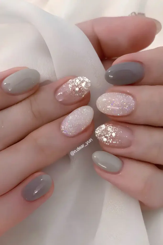 Gray Manicure With Accent Glitter That Adds Subtle Sparkle