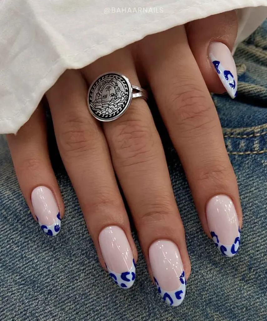 Light Blue French Mani With Leopard Print for a Bold Trendy Look