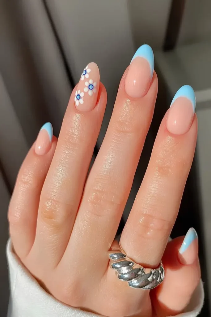 Light Blue French Manicure With Floral Art That Feels Fresh and Feminine